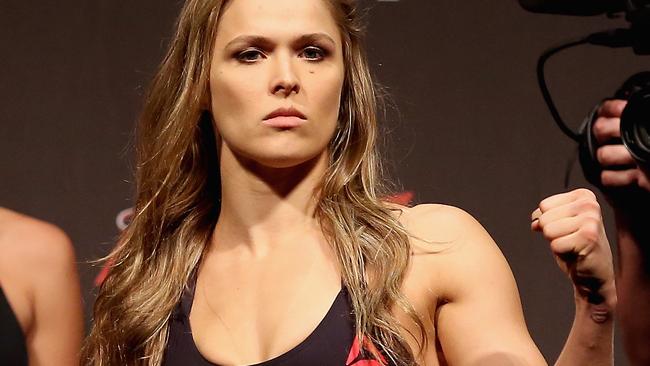 RIO DE JANEIRO, BRAZIL - JULY 31: UFC Strawweight Champion Ronda Rousey of the United States poses for photographers during the UFC 190 Rousey v Correia weigh-in at HSBC Arena on July 31, 2015 in Rio de Janeiro, Brazil. (Photo by Matthew Stockman/Getty Images)