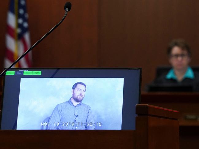 Judge Penney Azcarate listens to a previously recorded video deposition by Josh Drew, Raquel Pennington's ex-husband, during Johnny Depp's defamation trial against ex-wife Amber Heard. (Photo by KEVIN LAMARQUE / POOL / AFP)