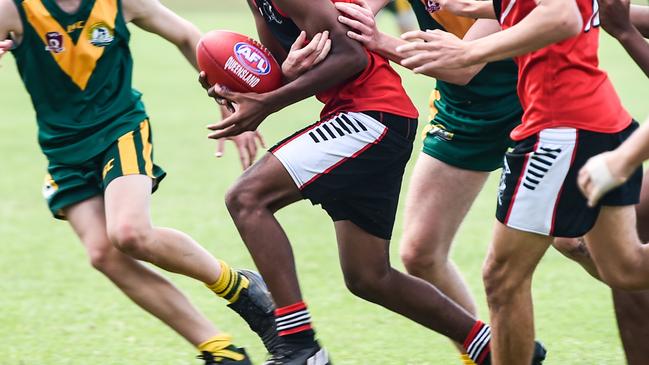 NQ AFL Championships at Murray. Junior Male Grand Final. Kirwan (red/black) v St BrendanÃ&#149;s College.