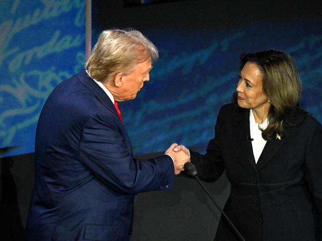 (FILES) US Vice President and Democratic presidential candidate Kamala Harris (R) shakes hands with former US President and Republican presidential candidate Donald Trump during a presidential debate at the National Constitution Center in Philadelphia, Pennsylvania, on September 10, 2024. Kamala Harris and Donald Trump are entering the final one-month sprint to the most dramatic US presidential election in modern history, with both candidates warning the fate of a divided nation hangs on a result that is still too close to call. (Photo by SAUL LOEB / AFP)