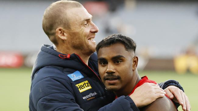 MELBOURNE, AUSTRALIA - MARCH 23: Simon Goodwin, Senior Coach of the Demons and Kysaiah Pickett of the Demons embrace after  the round two AFL match between Hawthorn Hawks and Melbourne Demons at Melbourne Cricket Ground, on March 23, 2024, in Melbourne, Australia. (Photo by Darrian Traynor/Getty Images)