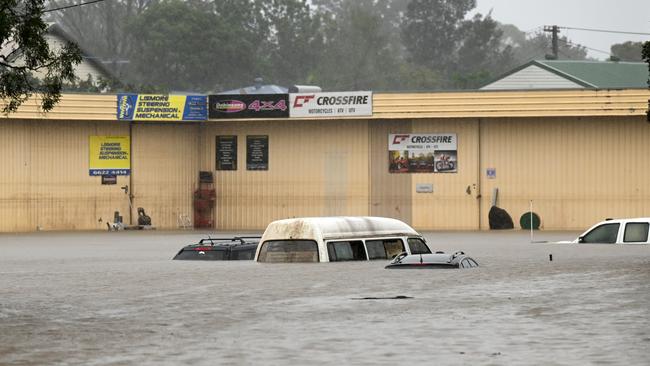 Floodwater inundate cars on March 30, 2022 in Lismore. It is the second major flood event for the region this month. (Photo by Dan Peled/Getty Images)