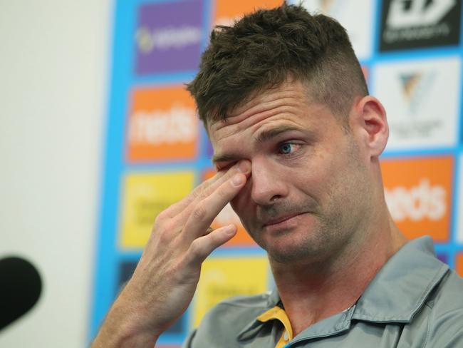 An emotional Anthony Don announces his retirement from the NRL at a press conference at the Gold Coast Titans Parkwood base, alongside coach Justin Holbrook . Picture Glenn Hampson