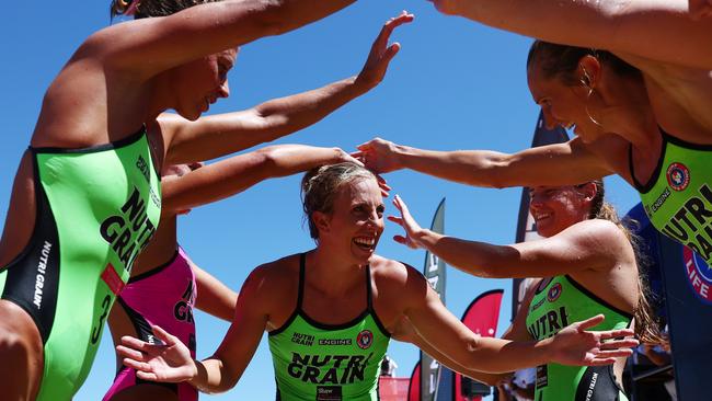 Georgia Miller celebrates with mates on the beach.