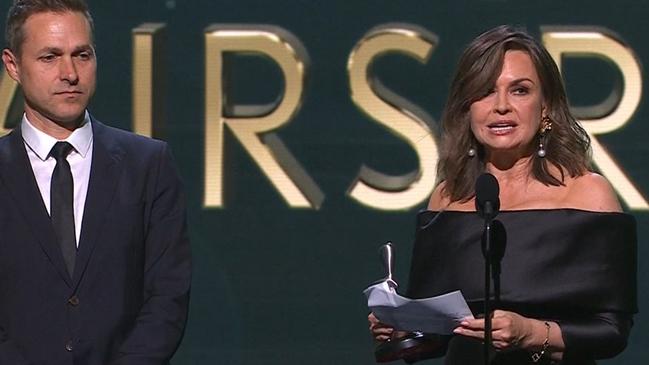 Lisa Wilkinson, with producer Angus Llewellyn, delivers her speech at the 2022 Logies. Picture: Channel 9