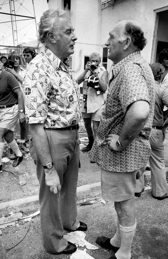 Prime Minister Gough Whitlam and Major General Alan Stretton talk in Darwin in the aftermath of Cyclone Tracy, in 1974. Picture: Barry Ledwidge.