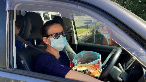 Elisabeth freudigmann of Indooroopilly in her car after having a coronavirus test today. Picture: Brendan O’Malley