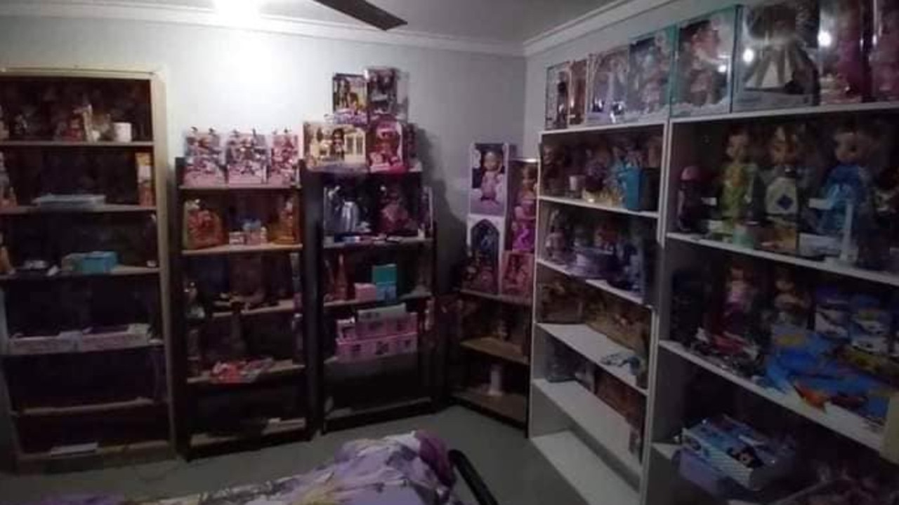 Images shared to Kelly’s Facebook page show bookcases filled with dolls.
