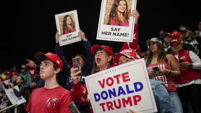 Supporters for Donald Trump hold images of Laken Riley before he speaks at a "Get Out the Vote" rally in Rome, Georgia, on March 9. Picture: Elijah Nouvelage / AFP