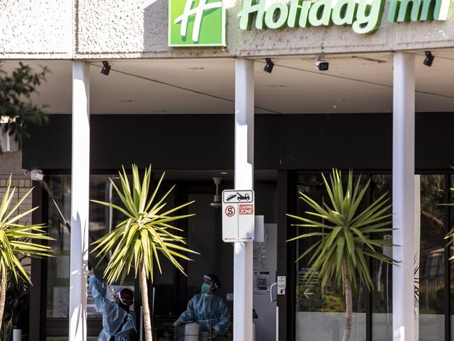 Cleaners wearing full PPE at the Holiday Inn. Picture: Getty Images