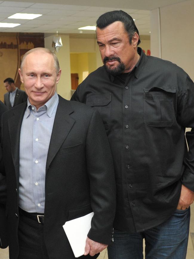 Russia's President Vladimir Putin and Steven Seagal visit a newly-built sports complex in Moscow. Picture: AFP 