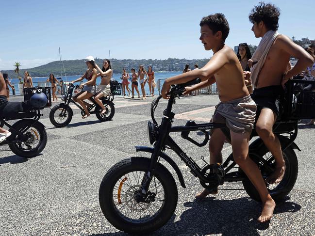 DAILY  TELEGRAPH 28TH JANUARY 2025Pictured in Manly are young people using the hugely popular DiroDi Rover E- Bike. The community is split on issues about where the bike is ridden.Picture: Richard Dobson
