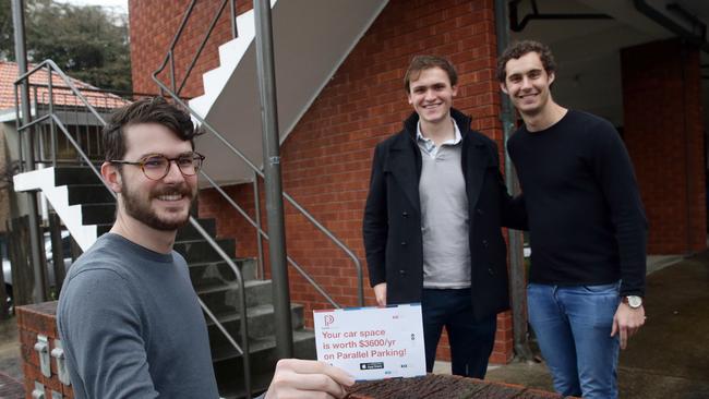 App creators Alex Peck and Jack Perkins with head of technology Peter Carey. Picture: Craig Wilson