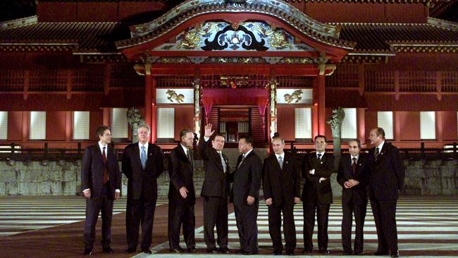 Schroder and Putin pictured here in a photograph taken in Okinawa Japan, July, 2000. From left to right: former British Prime Minister Tony Blair, former President Bill Clinton, former Canadian Prime Minister Jean Chretien, former Austrian Chancellor Gerhard Schroder, Japan's former Prime Minister Yoshiro Mori, Russian President Vladimir Putin, former E.U. President Romano Prodi, former Italian Prime Minister Giuliano Amato, and former French President Jacques Chirac. Picture: Tom Hanson/AFP Photo