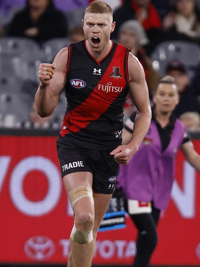 MELBOURNE, AUSTRALIA - AUGUST 20: Peter Wright of the Bombers celebrates a goal  during the round 23 AFL match between the Essendon Bombers and the Richmond Tigers at Melbourne Cricket Ground on August 20, 2022 in Melbourne, Australia. (Photo by Darrian Traynor/Getty Images)