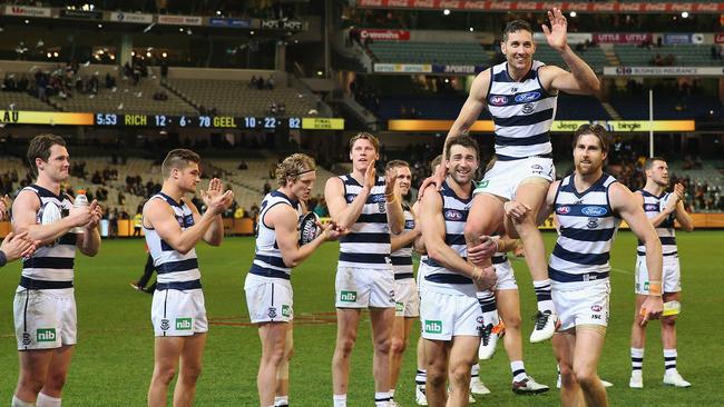 Matchwinner Harry Taylor is chaired off.