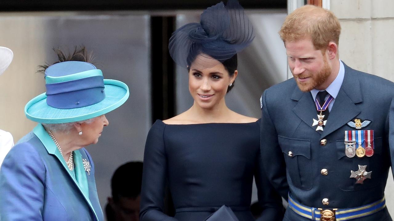 Queen Elizabeth II, Meghan, Duchess of Sussex and Prince Harry, Duke of Sussex watch the RAF fly-past on the balcony of Buckingham Palace in 2018. Picture: Chris Jackson/Getty Images