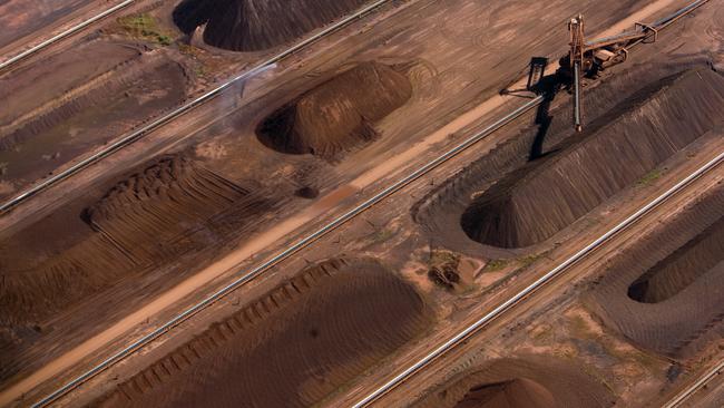 Iron ore awaits loading at a BHP loading facility in Port Hedland. Picture: Bloomberg