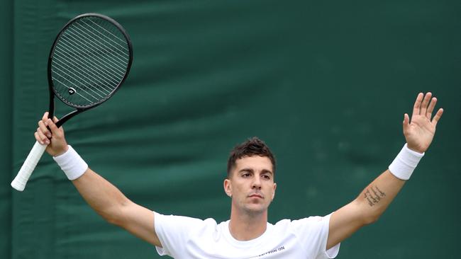 Thanasi Kokkinakis of Australia celebrates winning match point against Felix Auger-Aliassime of Canada. (Photo by Clive Brunskill/Getty Images)