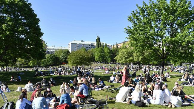 People enjoy the sunny weather in Tantolunden park in Stockholm early in the novel coronavirus pandemic. Picture: AFP