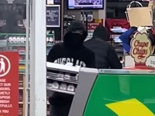 A gang of masked teens is filmed robbing the Hughesdale BP. Picture: Supplied