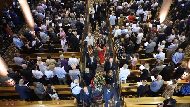 Dr Lowitja O’Donoghue’s coffin is carried out to the waiting car. Picture: NCA NewsWire / David Mariuz