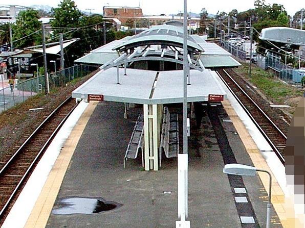 MP152097 ALW 5Sep  -  A female train comuter on Woodridge station.