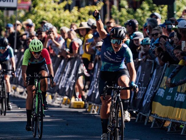 Hobart's Felicity Wilson-Haffenden celebrates winning the under-19 national road race in Ballarat on Sunday.