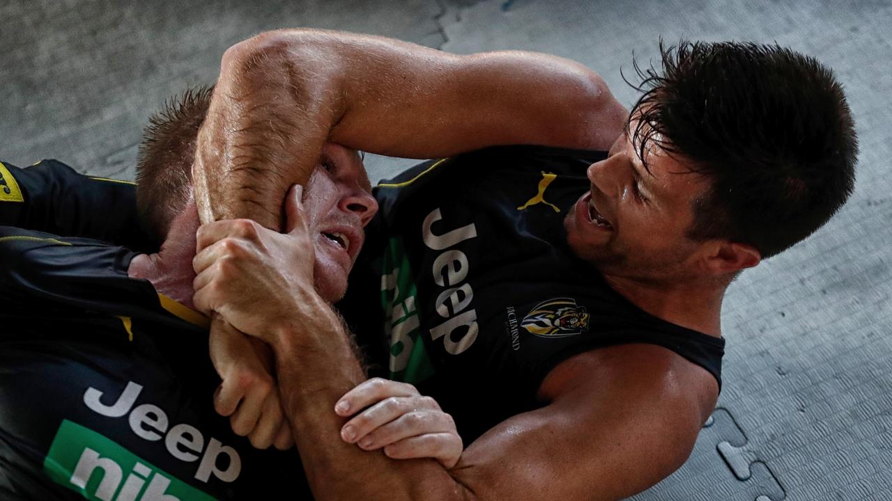 Jack Riewoldt and Trent Cotchin tangle during Richmond’s pre-season training camp in Queensland. (Photo by Michael Willson/AFL Media)