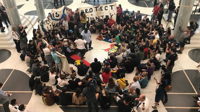 Indigenous rights protesters inside the foyer at Parliament House. Picture: Gary Ramage