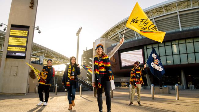 Dedicated crows fans Eric Cruz, Cristina Garcia, Madeleine Holzinger and Ben Onofrio at Adelaide Oval. Picture: Morgan Sette