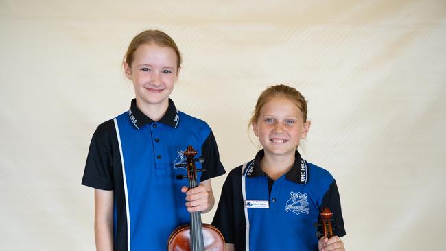 Maya McBride and Laura Wilcox from One Mile State School prepare for the small instrumental ensemble strings (primary school) at the Gympie Eisteddfod. August 1, 2023. Picture: Christine Schindler