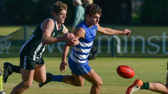 Westminster’s Harvey Bock and St Peters’ Sam Warrick chase the ball during their round two college football clash on Saturday. Picture: Brenton Edwards