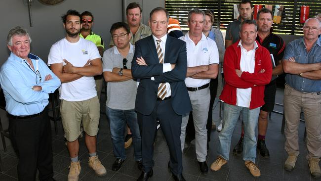 Games Village sub-contractors out of pocket after collapse of site contractor Ware Building meet at Oxenford Tavern to discuss their next move. Pictured are builders (L to R) Frank Cairns, Emanuel Ibrahim, Dale Martin, Perry Richardson, Shane Tanner, Patrick Ashton, Melissa Slattery, David Mawhinney (red), Norbert Vigh (back Grey shirt), Bruce Alker Jrn, Brian Pollock with lawyer James Loel (foreground). Photo: Steve Holland