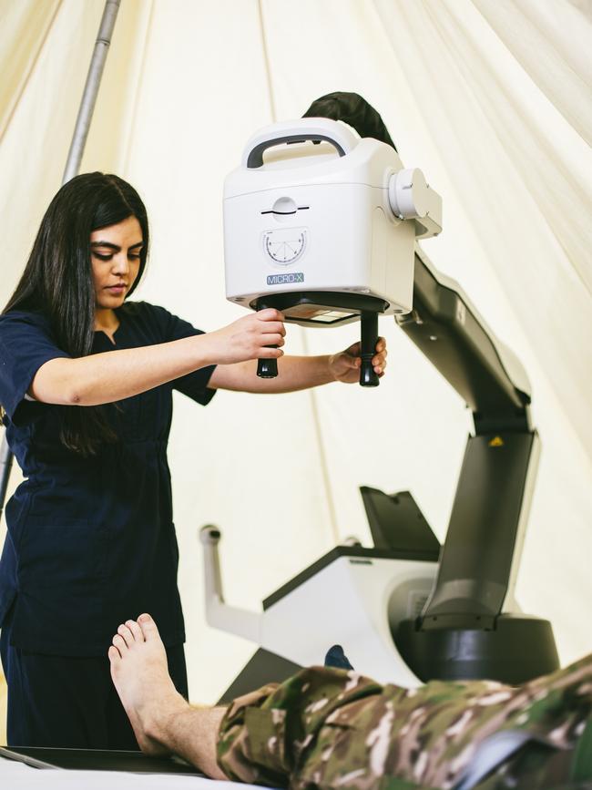 Mariana Bogota demonstrates fine bedside positioning of the Micro-X Rover deployable mobile x-ray device. Picture: Miles Rowland