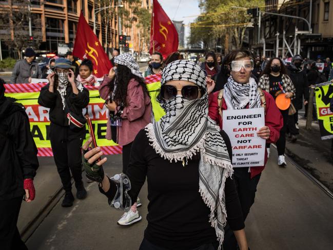 Protesters chant while blocking traffic. Picture: Darrian Traynor