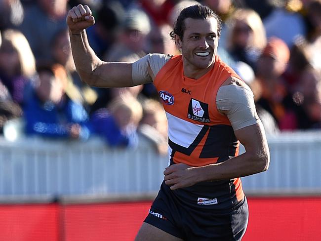 Sam Reid of the Giants celebrates after kicking a goal against Richmond