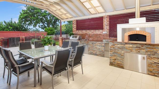 The outdoor alfresco area has a pizza oven, barbecue and plenty of space to enjoy.