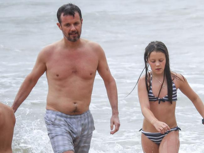 Fred and Isabella take the boogie board for a spin. Princess Mary and her royal family hit Sydney’s Palm Beach for a dip before they head to Tasmania for an Aussie Christmas. Picture: Media Mode