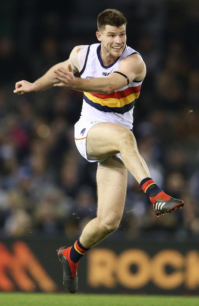 Adelaide's Bryce Gibbs drives the Crows forward on Saturday night. Picture: Michael Klein