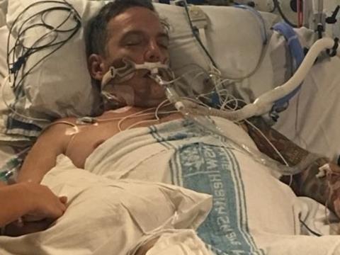 Russell Marsh was healthy but is now in a critical condition after a patient coughed on him. Picture: Gofundme/Supplied