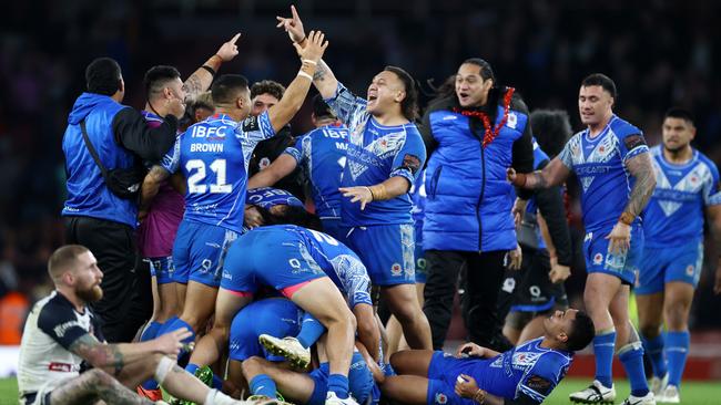 Josh Papalii celebrates with teammates. Photo by Michael Steele/Getty Images.