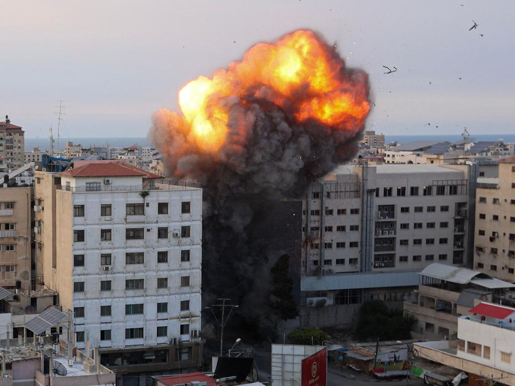 Fire and smoke rise after an Israeli air strike targeted the National Bank on Gaza City. Picture: AFP