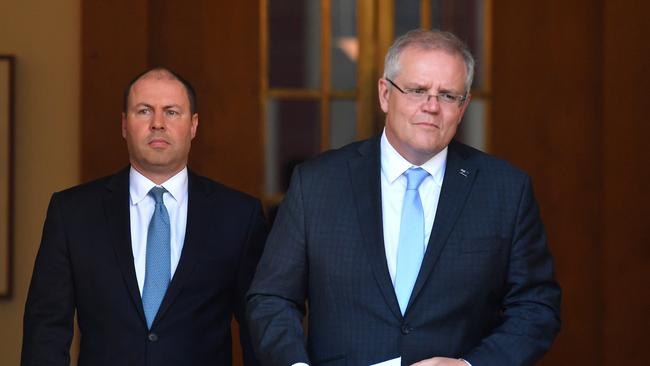 Federal Treasurer Josh Frydenberg and Prime Minister Scott Morrison arrive to announce $130b wage subsidy package at a press conference in March. Picture: AAP