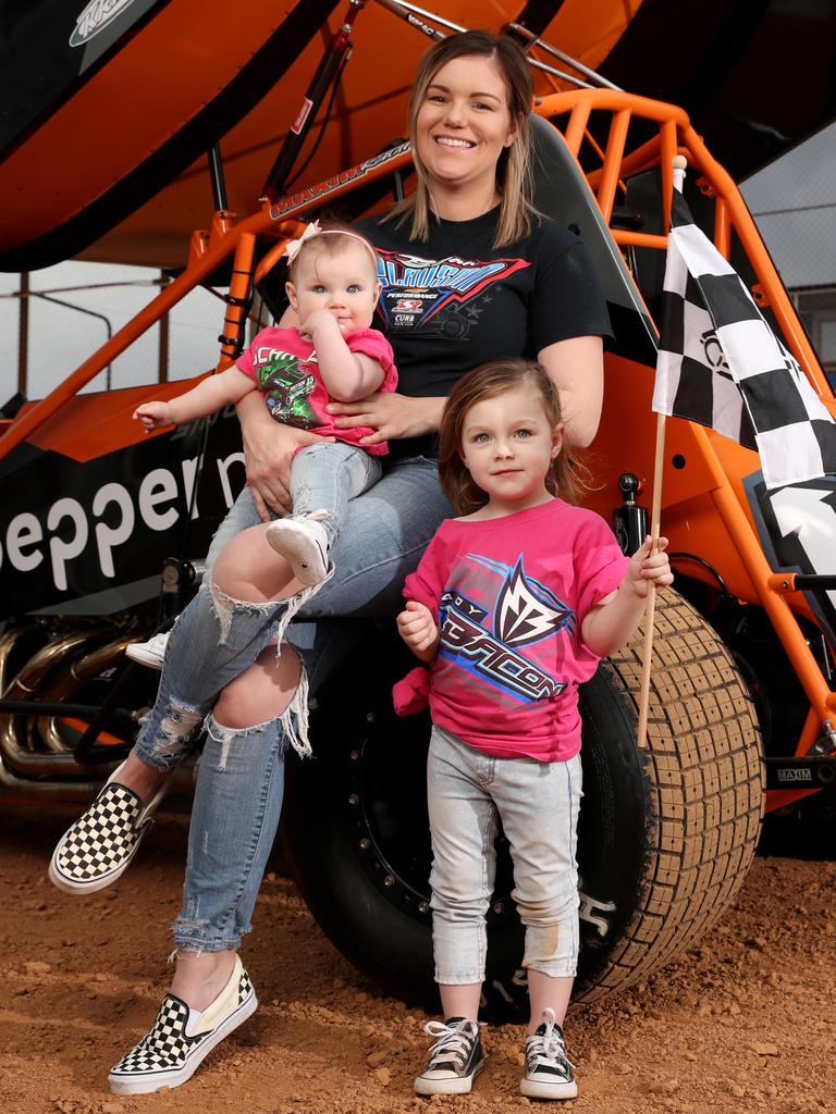 Sprint car driver Mikaela Darcy and her daughters, Callie 3 &amp; Addie (Addison) 8 months at the Sydney Speedway in Granville. Picture: Jonathan Ng