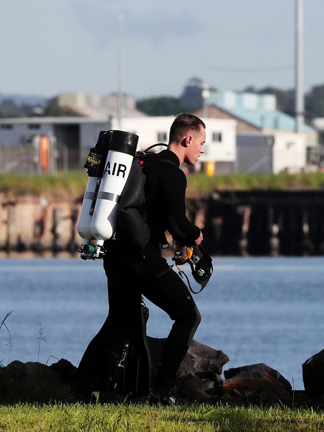 A police diver at the Port of Newcastle on Tuesday morning. Picture: Peter Lorimer