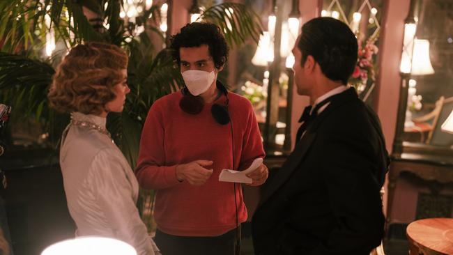 Margot Robbie, Director Damien Chazelle and Diego Calva on the set of Babylon.