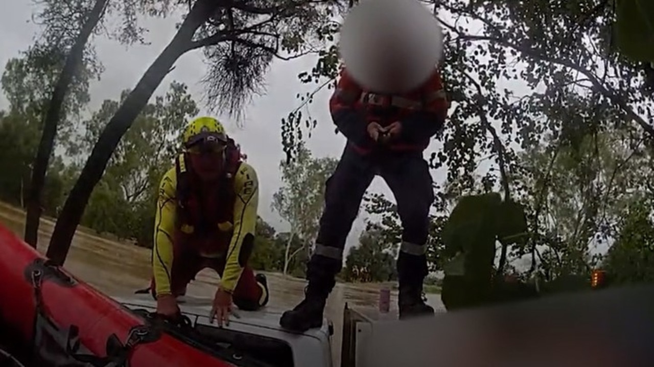 Swift water rescue crews rescued a driver stranded on his ute's roof after his vehicle was swept of the roadway at Balyendo crossing. Image: QFD