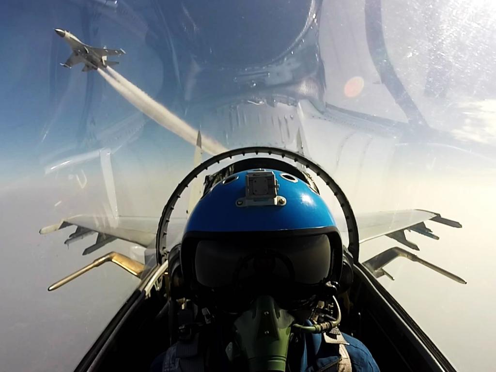 Two Chinese jet fighters during a military drill in the South China Sea near China’s Hainan Island. An area off the east coast of China’s island province of Hainan hosted military exercises from July 19 to 21. / AFP PHOTO / STR / China OUT