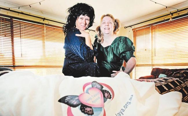 TASTY FROCKS: Cathy Puglisi (left) and Helen Hanslow, of Ballina, get all dolled up in their finest bad taste frocks to raise money for the Help Talaya Appeal. Picture: Jay Cronan